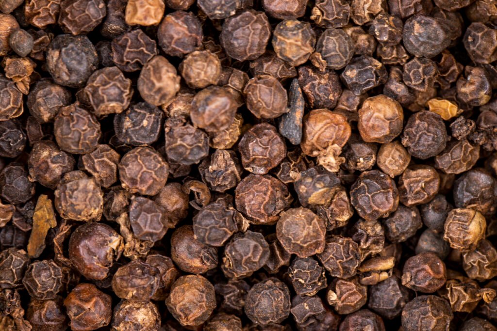 Products background of black peppercorn top view
